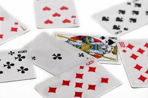 Exploring strategy and chance with a vibrant deck of cards scattered creatively on a surface photo