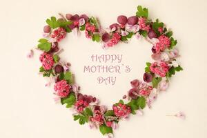 Heartshaped botanical frame with copy space. Floral background with text. Happy mothers day photo