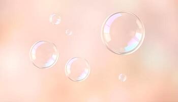 soap bubbles floating in the air on a pink background photo