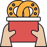 A person is holding a red container with two doughnuts in it vector