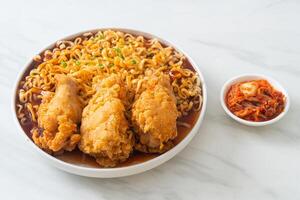 Korean instant noodles with fried chicken or Fried chicken ramyeon photo