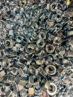 Metal nuts background. Working tools. Fixing elements. High quality photo
