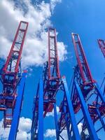 Container cranes against blue sky. High quality photo