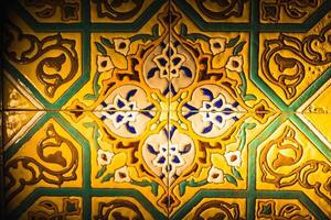 Colorful vintage surface with an old oriental pattern. The background is a texture that has a decorative value. For overlay or texture designs photo