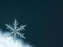 A snowflake is shown on top of a blue background photo