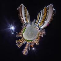 abstract swirling tiny planet spherical panorama of multi-storey buildings of skyscrapers of a residential complex in the form of a butterfly, bugs, crabs in night sky photo