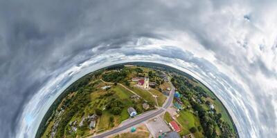 simple little tiny planet without buildings in blue sky with sun and beautiful clouds. Transformation of spherical panorama 360 degrees. Spherical abstract aerial view. Curvature of space. photo