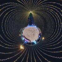 new year tiny planet with Christmas tree. Spherical aerial 360 panorama night view on festive square with illumination in form of tent photo