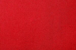 Red fabric texture useful as a background with copy space in high-resolution photo