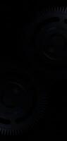 Dark two cog wheels spinning with snapping line effect creating a dynamic 3D motion in seamless loop animation video