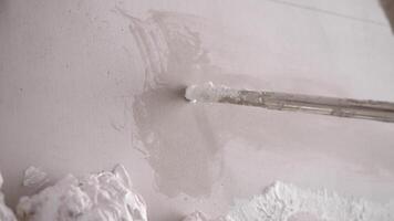 Thin strip of white foam is applied to wall to create unique and decorative element. foam forms bas-relief, adding depth and texture to design. video