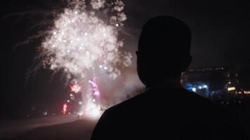 New Year Eve Fireworks Display on Bali Beaches and Silhouette of People Celebrating it in Slow Motion video