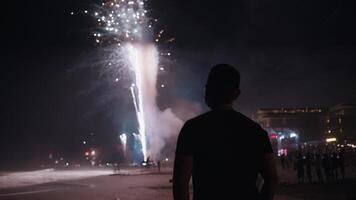 New Year Eve Fireworks Display on Bali Beaches and Silhouette of People Celebrating it in Slow Motion video