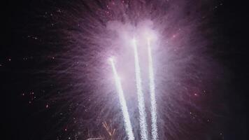 New Year Eve Fireworks Display on Bali Beaches and Silhouette of People Celebrating it in Slow Motion video