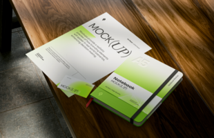 Realistic stationery mockup with A5 notebook and letterhead on wooden table psd