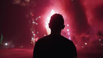 New Year Eve Fireworks Display on Bali Beaches and Silhouette of People Celebrating it in Slow Motion video