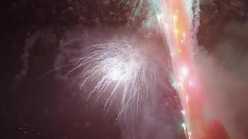 New Year Eve Fireworks Display on Bali Beaches and Silhouette of People Celebrating it in Slow Motion video