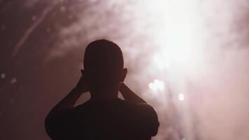 New Year Eve Fireworks Display on Bali Beaches and Silhouette of People Celebrating it in Slow Motion video