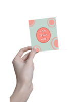 Mockup of greeting card in hand without background For your Design psd
