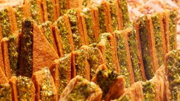 Enjoy the mouthwatering and delicious Baklava Slices that come with a delightful Pistachio Topping video