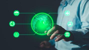 Climate change,hand hold hologram to save energy,and reduce global warming,ecology friendly investment,ESG environment social governance,Green Business Innovation and Sustainable Development concept. photo