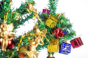 Festive Christmas Tree with Ornaments and Gifts on White Background for Holiday Celebrations photo