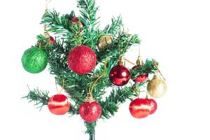 A small christmas tree with ornaments on it photo