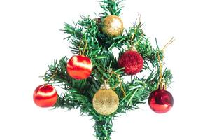 A small christmas tree with ornaments on it photo