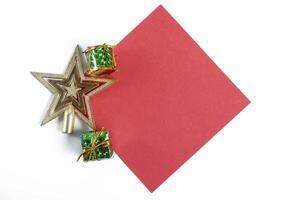 A red paper with a star and gift boxes on it photo