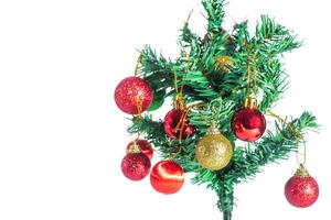 A small christmas tree with ornaments on it photo