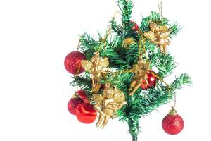A christmas tree with gold ornaments and red balls photo