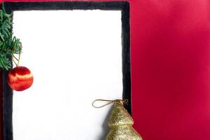 Christmas tree and christmas decorations on a red background photo