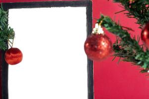 A blank white frame with christmas decorations on it photo