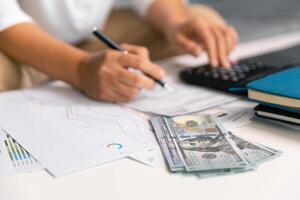 After inspecting finance documents and paperwork, he carefully calculated each tax deduction before filing, hoping for substantial refund on his income. interest, manager, pay, plan, preparation, irs photo