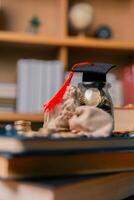Planning for education abroad involves saving money and making wise investments in finance, which can lead to graduation success, future wealth, cognitive growth, and well-managed budget. hat, idea photo