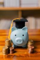 Planning for education abroad involves saving money and making wise investments in finance, which can lead to graduation success, future wealth, cognitive growth, and well-managed budget. hat, idea photo