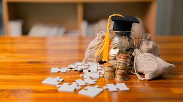 Planning for education abroad involves saving money and making wise investments in finance, which can lead to graduation success, future wealth, cognitive growth, and well-managed budget. hat, idea photo