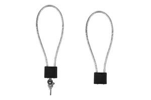 Two security cable locks with black rectangular locking mechanisms, one with a key inserted, isolated on a white background, ideal for securing laptops or other valuable items photo