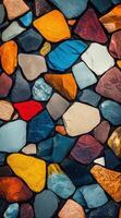 Colorful smooth pebbles tightly packed, creating a vibrant mosaic pattern. Multicolored background. photo