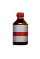 Brown glass bottle with a red cap and a blank label, isolated on a white background, often used for storing chemicals or pharmaceuticals in a safe and secure manner. photo