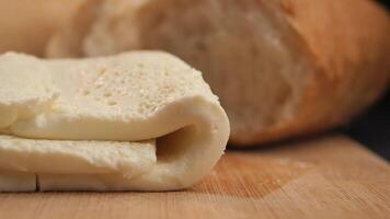 Freshly Baked Bread with a Soft Slice of Cheese Perfect for Any Meal video