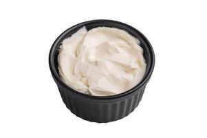Fresh Sour cream in a bowl isoalted on white background. top view photo