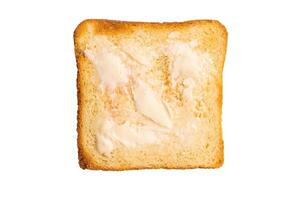 Toast from white bread with butter isolated on white background. top view photo