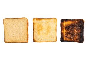 Set of slices of toasted bread, different colors, isolated on white background. top view photo