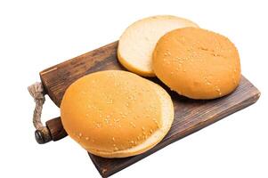 Baked burger buns isolated on white background. top view photo