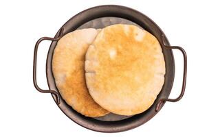 A stack of pita breads isolated on white background. top view photo