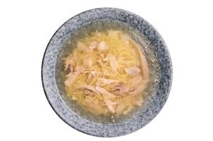 Chicken soup with Vermicelli and meat in a plate isolated on white background photo