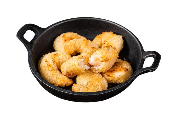 Fried Breaded Shrimps Prawns in a pan. Isolated on white background. Top view.