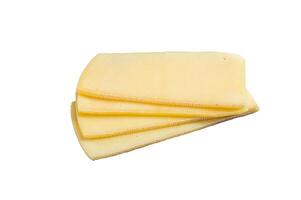 Uncooked Raclette Swiss cheese slices. Isolated on white background photo