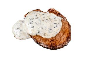 Grilled sirloin beef meat steak with peppercorn sauce. Isolated on white background. photo